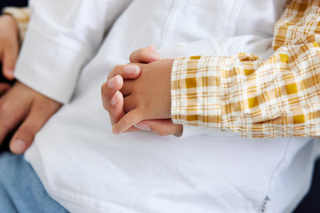 Japan parent  and child  holding hands in the living roomの写真素材