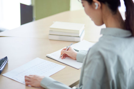 Japan woman studying in the libraryの写真素材
