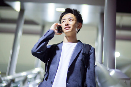 Young businessman and night stationの写真素材