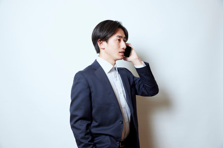 Portrait of young Japan businessman in suitの写真素材