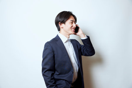 Portrait of young Japan businessman in suitの写真素材