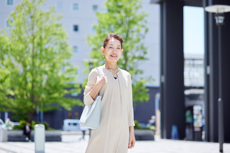 Senior female president working in an office district in springの写真素材