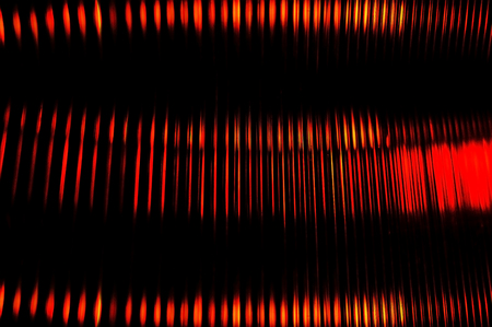 Multicolored abstract background blur of street lights in motion. Multicolored striped lines and spots. View through the window of polycarbonate, Long exposure.の写真素材