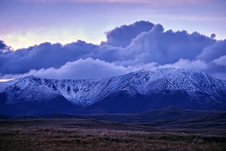 Beautiful autumn sunset landscape in the snow-capped mountains.の写真素材