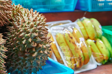 Fruits Durian in the foreground on counter a street vendor. Copy space.の写真素材