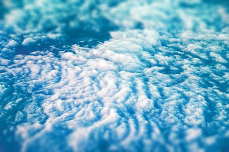 View from stratosphere on the field of thick white clouds.の写真素材