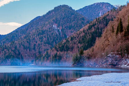 Mountain lake on the background of mountains and blue sky