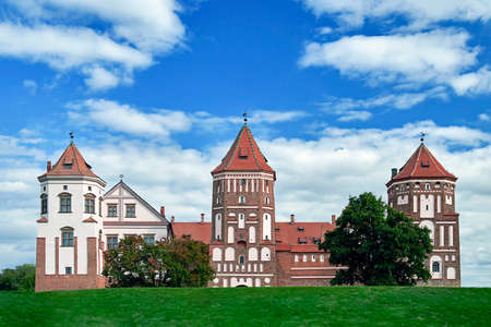 08.09.2021, Belarus-Mir castle of the 16th century with towers. Medieval fortress with brick on the background of the sky, sunny summer day.のeditorial素材