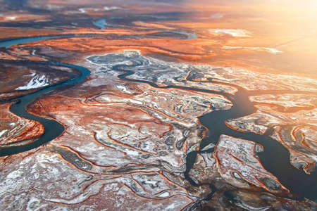 Autumn tundra from a bird's eye view. Photography from the plane.