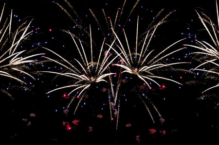 Beautiful abstract pattern with salute fireworks on dark background.の写真素材