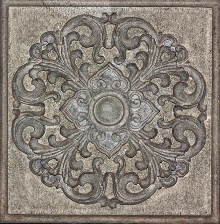 Art carved on stone wall in chinese temple, Thailand の写真素材