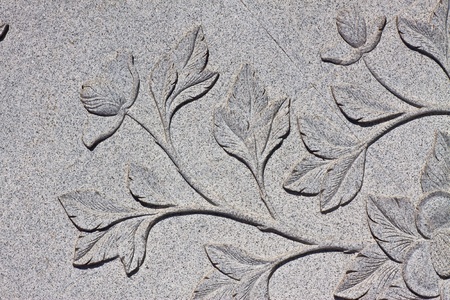 Art carved on stone wall in chinese temple, Thailand 