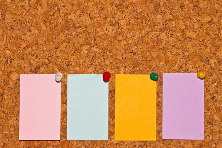 papers on cork boardの写真素材