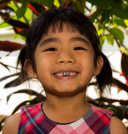 Smile, Closeup face of a little Asian girlの写真素材