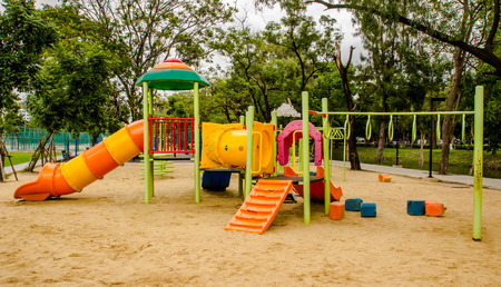 Colorful playground equipment at an outdoor parkの写真素材