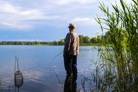 fisherman is fishing on the riverの写真素材