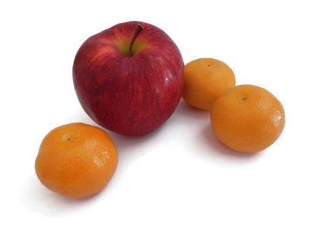 mandarin and apple isolated on a white backgroundの写真素材
