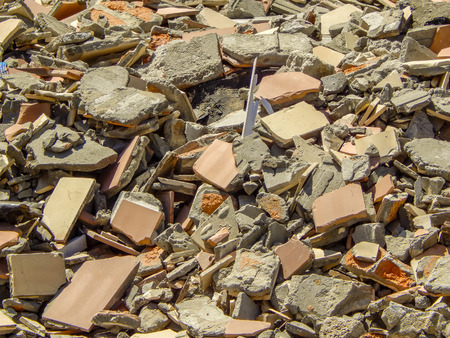 Full construction waste debris bags, garbage bricks, pile of rubble and material from demolished house.の写真素材