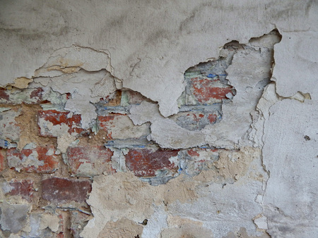 old wall stucco with scratches and cracks. Textured background.の写真素材