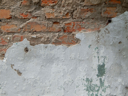 old wall stucco with scratches and cracks. Textured background.の写真素材