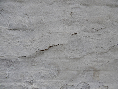 old wall stucco with scratches and cracks. Textured background.の写真素材