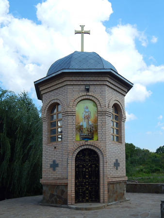 christian chapel in summer against a blue sky.の写真素材