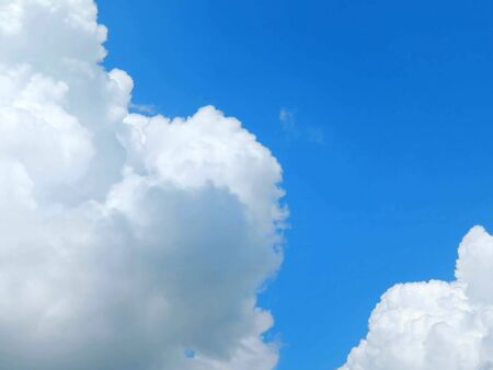 light blue sky with clouds, horizontal photo.の写真素材