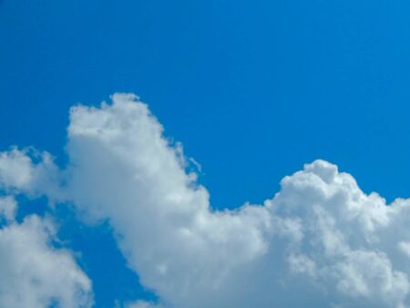 light blue sky with clouds, horizontal photo.の写真素材