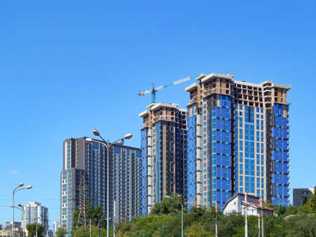 construction of a multi-storey building, against the blue skyの写真素材