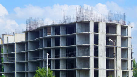 construction of a multi-storey building, against the blue skyの写真素材
