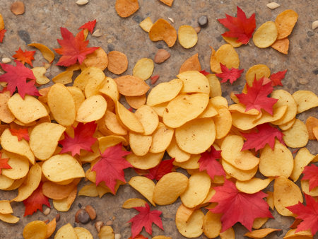 Crispy potato chips in a wicker bowl on old kitchen table.の素材