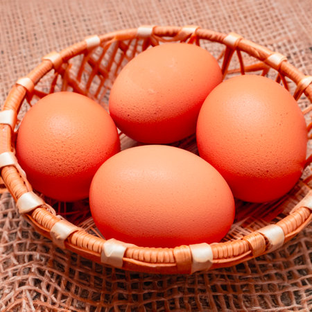 Chicken brown eggs in a wicker wooden basket Generative AIの素材