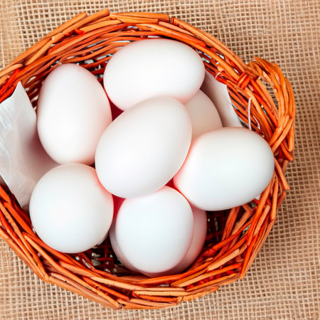 chicken white eggs in a wooden basket Generative AIの素材
