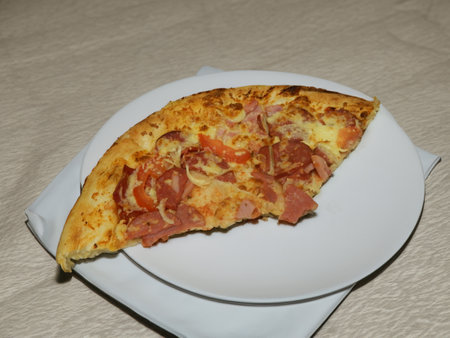 Pizza with salami sausage, mozzarella cheese, mushrooms, black olives, spicy tomato sauce and arugula, rustic wooden table background, top view.の写真素材
