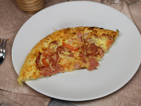 Pizza with salami sausage, mozzarella cheese, mushrooms, black olives, spicy tomato sauce and arugula, rustic wooden table background, top view.の写真素材