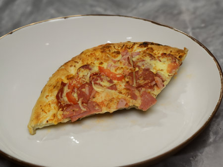 Pizza with salami sausage, mozzarella cheese, mushrooms, black olives, spicy tomato sauce and arugula, rustic wooden table background, top view.の写真素材