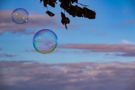 Bursting colorful bubbles in the sky. Copy space for textの写真素材