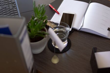 Blank paper notebook on office desk for planning and organizing. Top view anthracite office desk. Project Manager paper notebook scheduleの写真素材