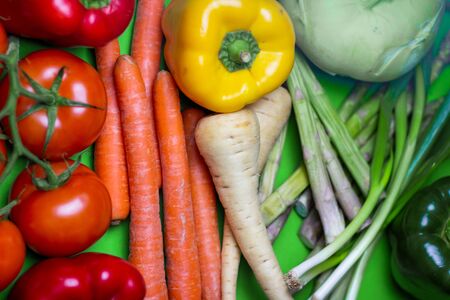 Colorful vegan food spectrum background. Organic and Fresh Vegetables Concept. Food art rainbow.の写真素材