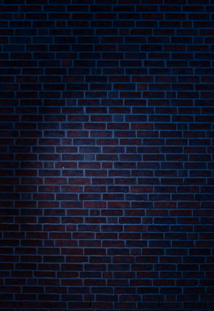 Dark brick wall background with a brings spotlightの写真素材