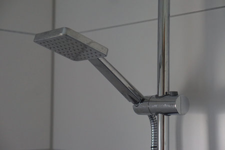 hand shower in bathroom typical and usual grease stains and finger printsの写真素材