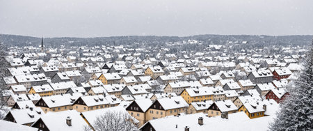 snow-covered german small town or city with old houses in winterの素材