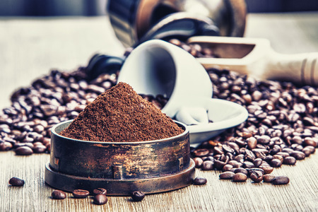 Coffe beans , cup of coffee and grinderの写真素材