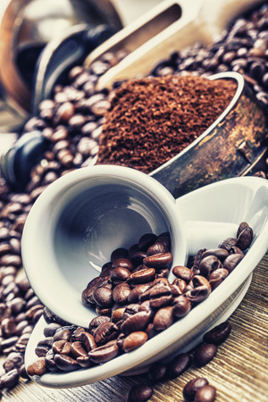 Coffe beans , cup of coffee and grinderの写真素材