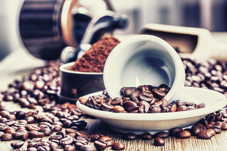 Coffe beans , cup of coffee and grinderの写真素材
