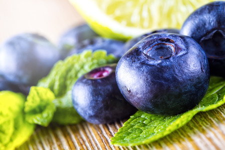 Blueberries limet and mint leavesの写真素材