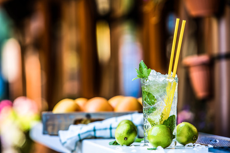 Mojito. Mojito cocktail. Cocktail glass on the bar counter outdoors. Alcoholic drink.の写真素材