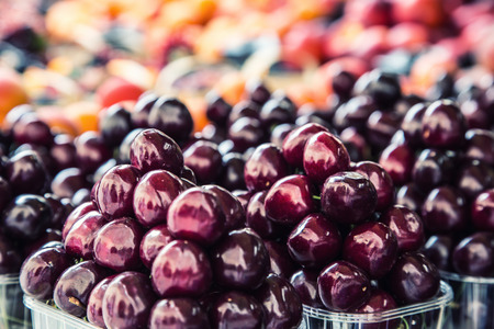 Berry fruits at a marketplace Blueberries, raspberries, strawberries, cherries Forest fruits. Gardening ,agriculture,harvest and forest concept.の写真素材