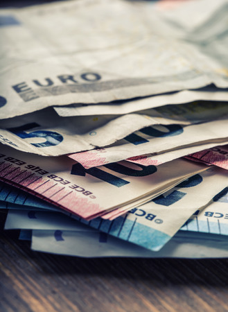 Several hundred euro banknotes stacked by value. Euro money concept. Euro banknotes. Euro money. Euro currency. Banknotes stacked on each other in different positions. Toned photoの写真素材