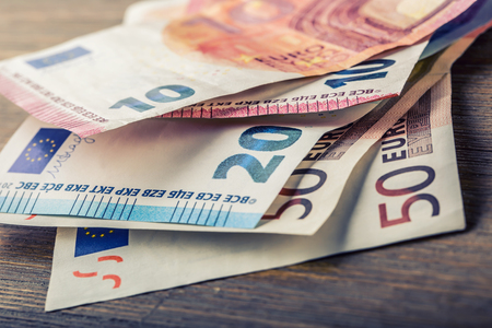 Several hundred euro banknotes stacked by value. Euro money concept. Euro banknotes. Euro money. Euro currency. Banknotes stacked on each other in different positions. Toned photo Several hundred euro banknotes stacked by value. Euro money concept. Euro banknotes. Euro money. Euro currency. Banknotes stacked on each other in different positions. Toned photo
